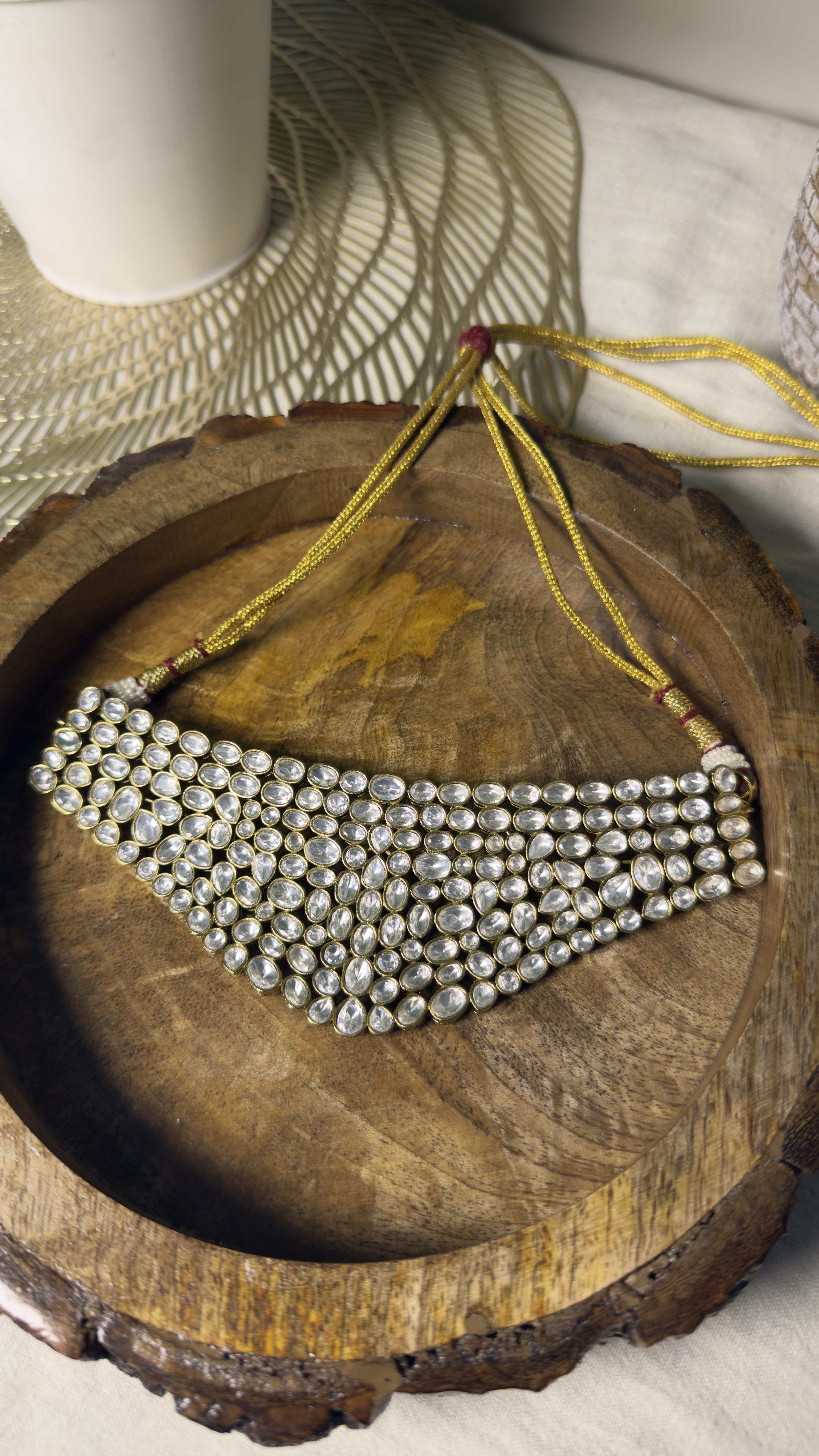 Samridhi Collection multi-row uncut polki bridal choker on carved wooden platter
