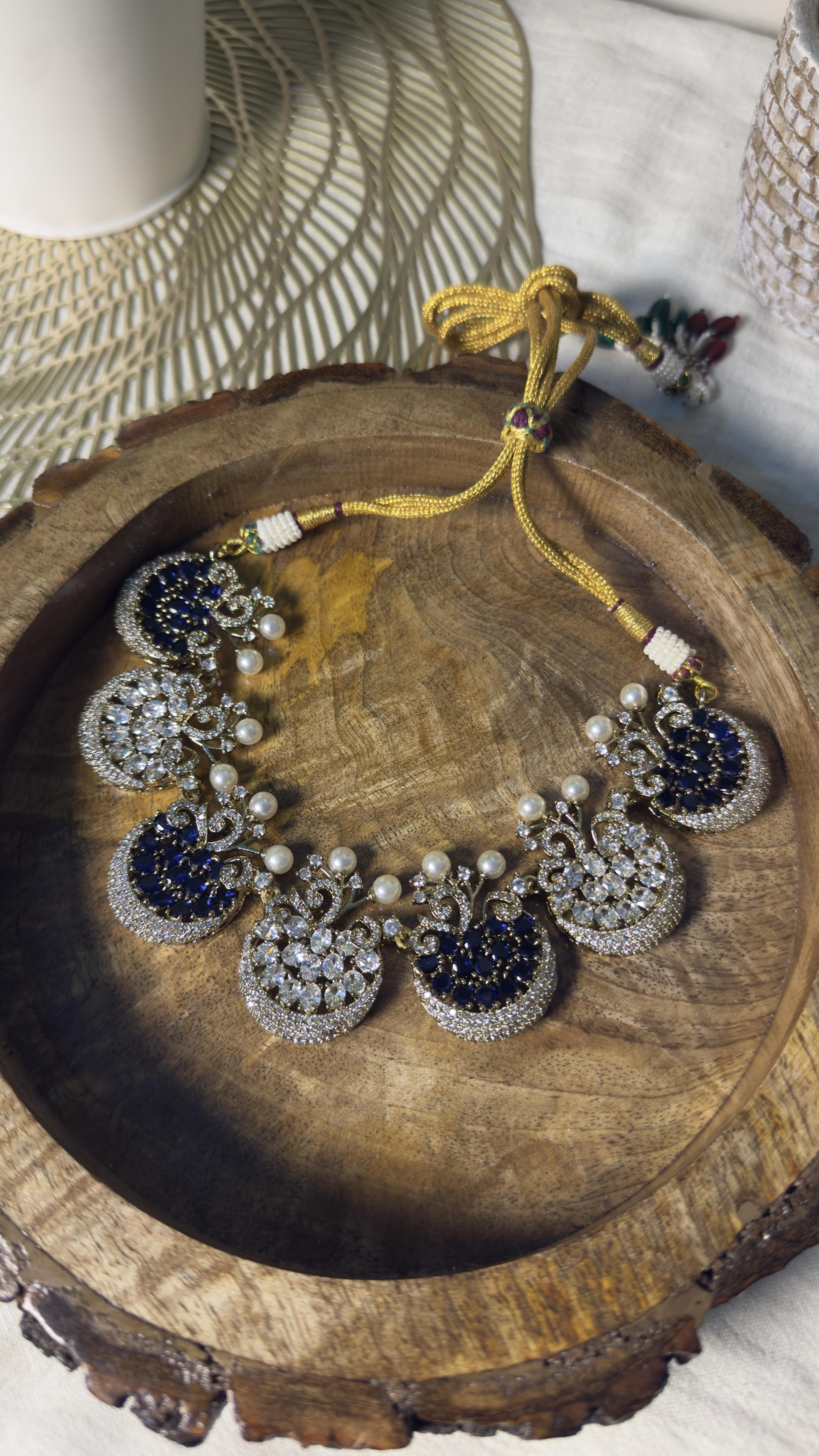 Samridhi Mayura Sapphire Necklace Set on wooden platter